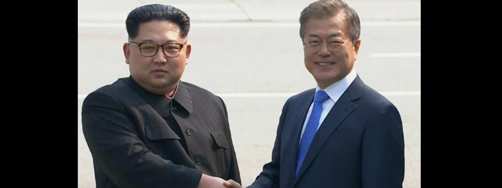 Two Korean leaders step into history