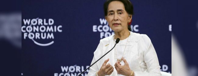 Suu Kyi defend verdict on Reuters arrested journos