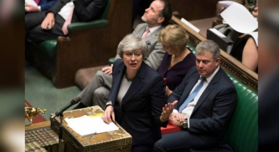 Britain parliament votes to delay Brexit deal 