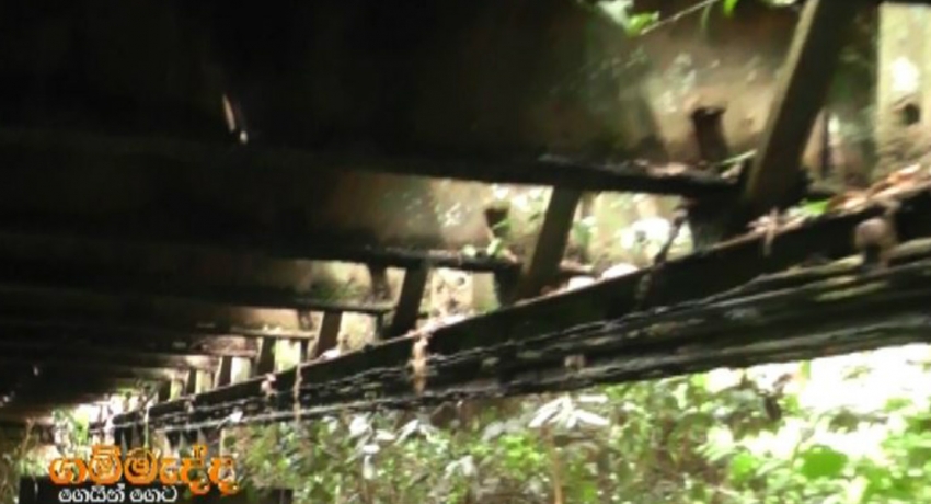 Villagers put lives on the line crossing ricketty 40 year old bridge