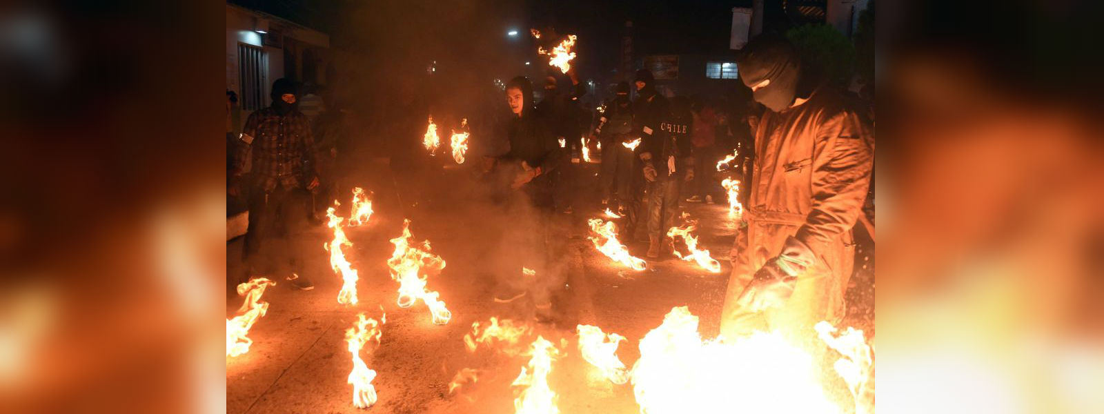 Salvadorans fling flaming fireballs at each other