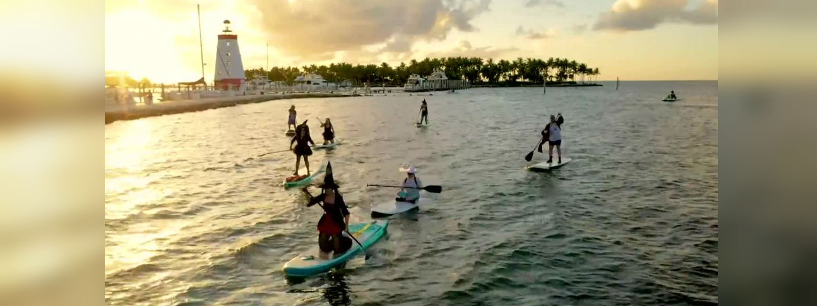 Witches celebrate October full moon by paddleboard