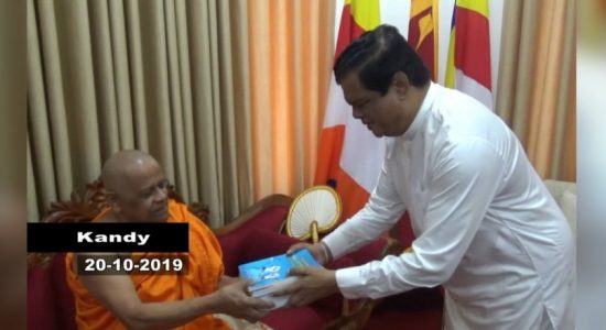 Books authored by Bandula Gunawardena presented to Asgiriya chief prelate