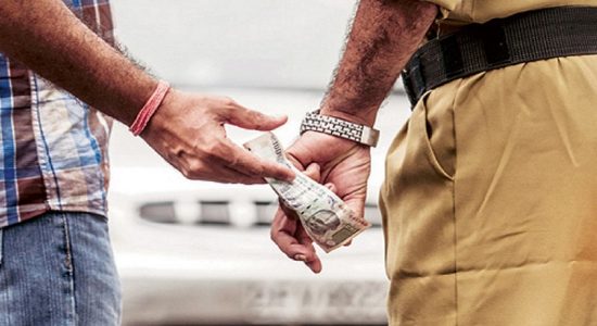 Suspect arrested while attempting to bribe police officer