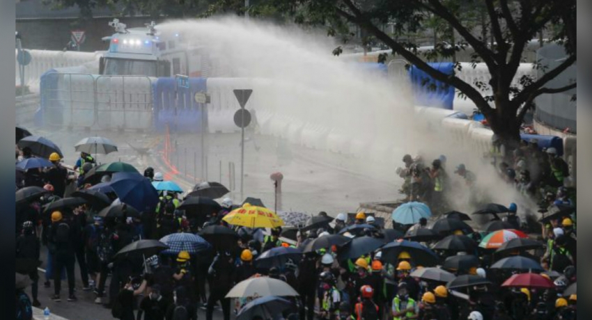 Hong Kong police fire water cannons to disperse protesters