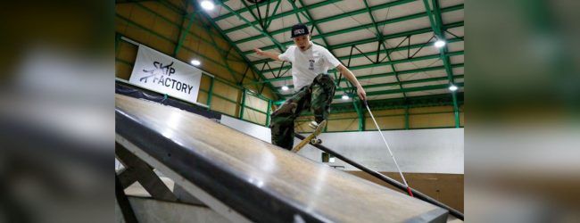 Blindskateboarder uses cane to ride the rails