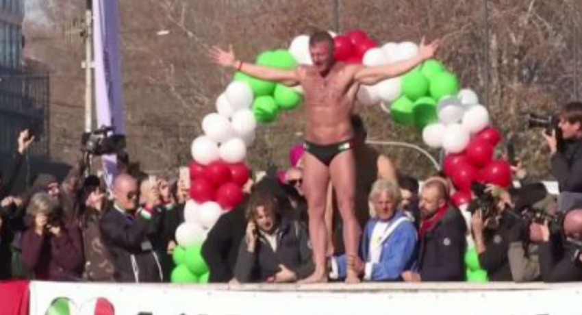 Italians dive into the icy waters of the Tiber River to celebrate the arrival of 2020