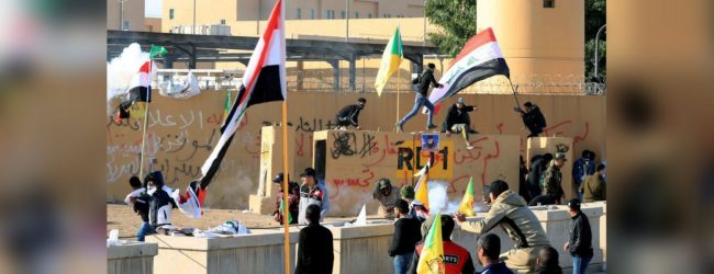 Iraqi militias withdraw from U.S. Embassy