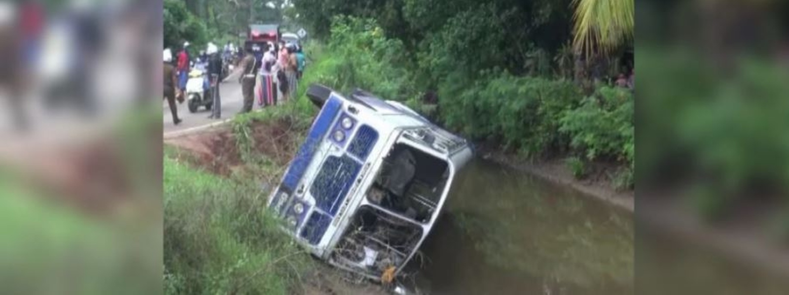 30 INJURED AFTER BUS CRASH INTO CANAL