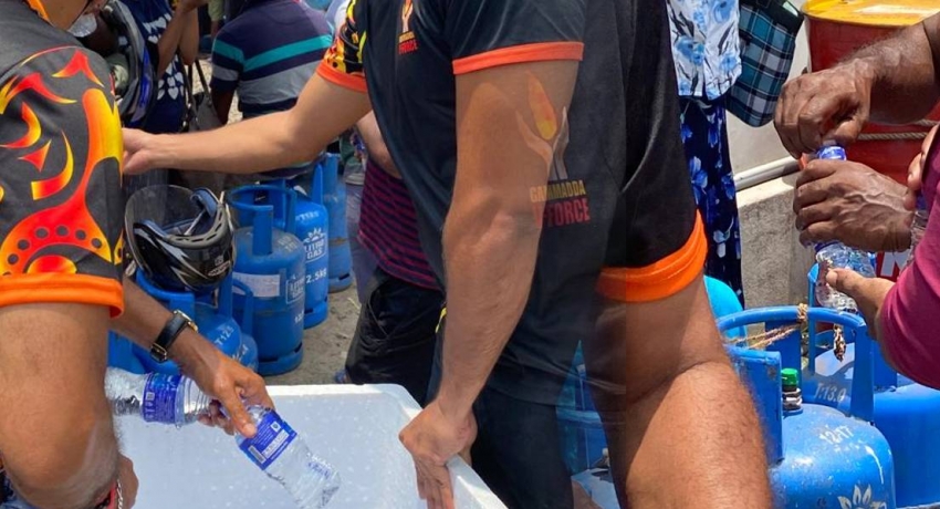 Gammadda V Force provides water to people in queues
