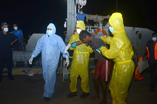 Navy brings ashore an ill fisherman for treatment