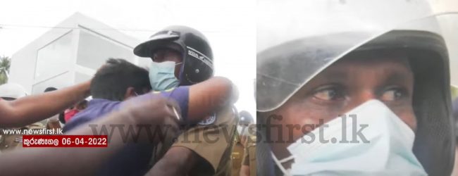 Police Officer tears up as protestor gives him a hug, in Sri Lanka