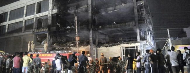 2 arrested after 27 die in massive Delhi fire, building owner on the run