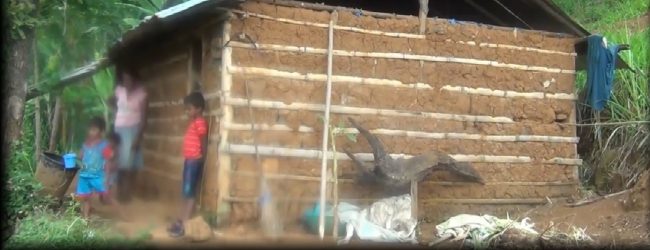 Family of four take turns to have a meal, as economic crisis takes it toll