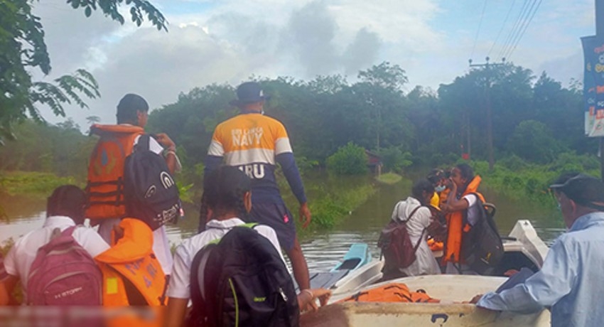 Sri Lanka Navy deploys 13 flood relief teams; transports students facing O/L exam by boat