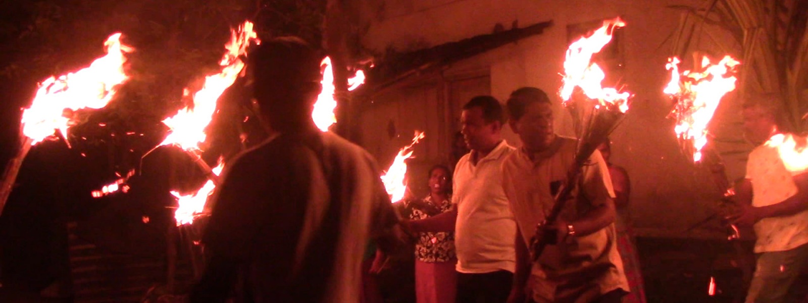Fishermen light torches in protest